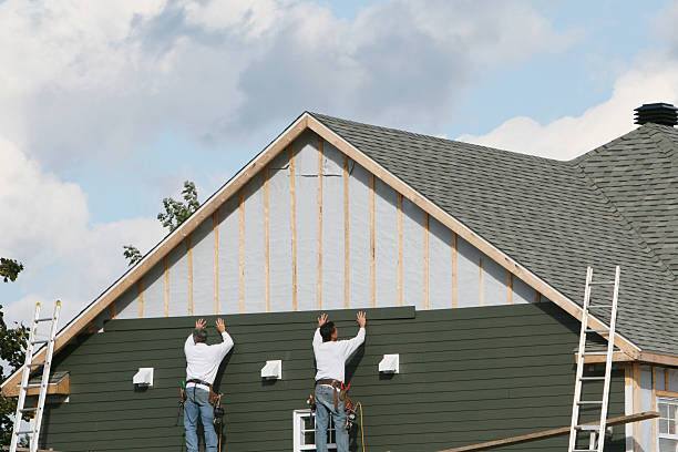 Professional Storm Damage Siding Repair technician working in Rhodesdale, MD